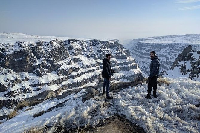 Multi-Day Winter Sightseeing Tour in Armenia - Noravank against red winter mountains