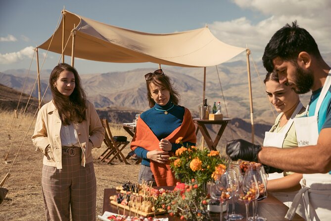 Winemaker's Table: Areni Cliffs - A dining table with Noravank below